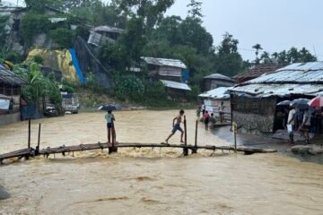These are the Rohingya children that enjoy the rainfall in camp. These children cross the bamboo bridge that attaches between two camps. photo courtesy of Ro Yassin Abdumonab