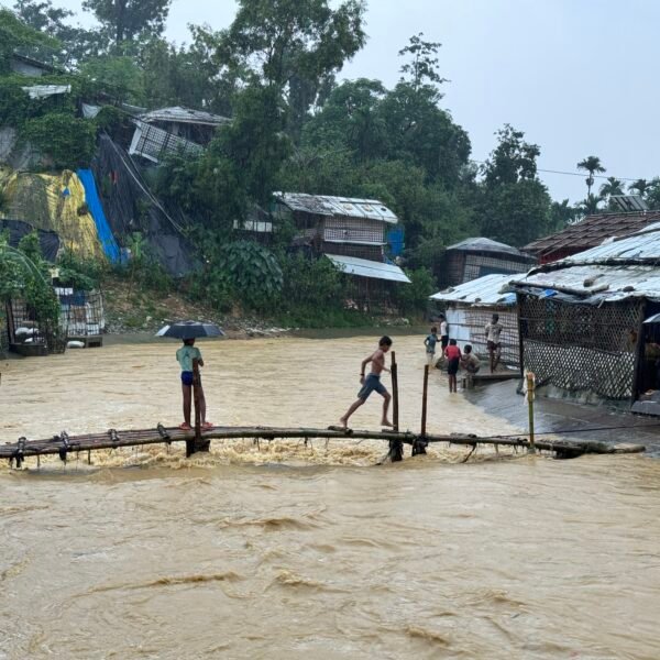 These are the Rohingya children that enjoy the rainfall in camp. These children cross the bamboo bridge that attaches between two camps. photo courtesy of Ro Yassin Abdumonab